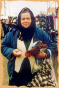 Woman selling chicken an egg